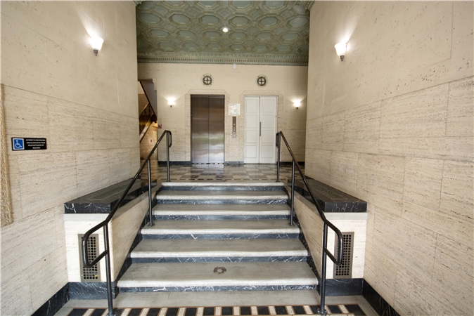 Historic marble lobby with elevators leading to the medical office